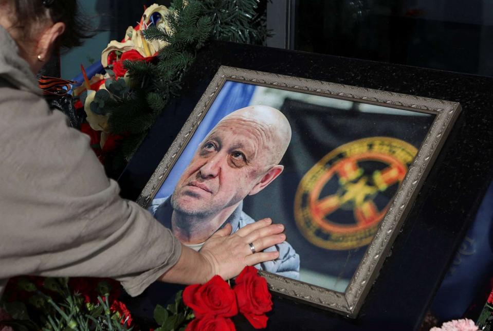 PHOTO: A woman mourns next to a makeshift memorial for Yevgeny Prigozhin, head of the Wagner mercenary group, as people mark 40 days since his death to respect an Orthodox tradition, in Saint Petersburg, Russia, Oct. 1, 2023. (Anton Vaganov/Reuters, FILE)