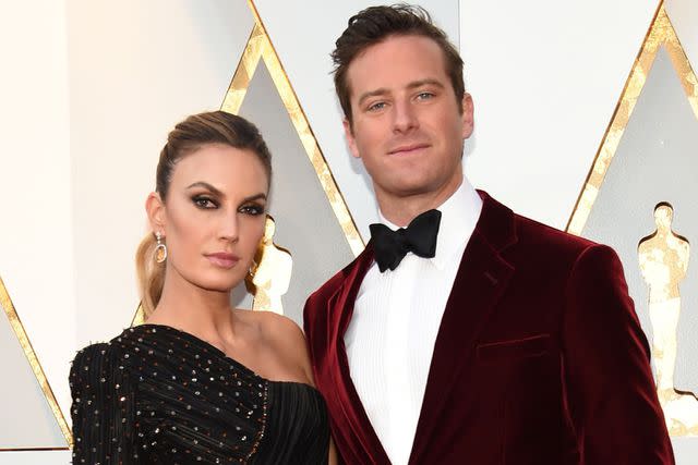 <p>VALERIE MACON/AFP via Getty</p> Elizabeth Chambers and Armie Hammer in 2018