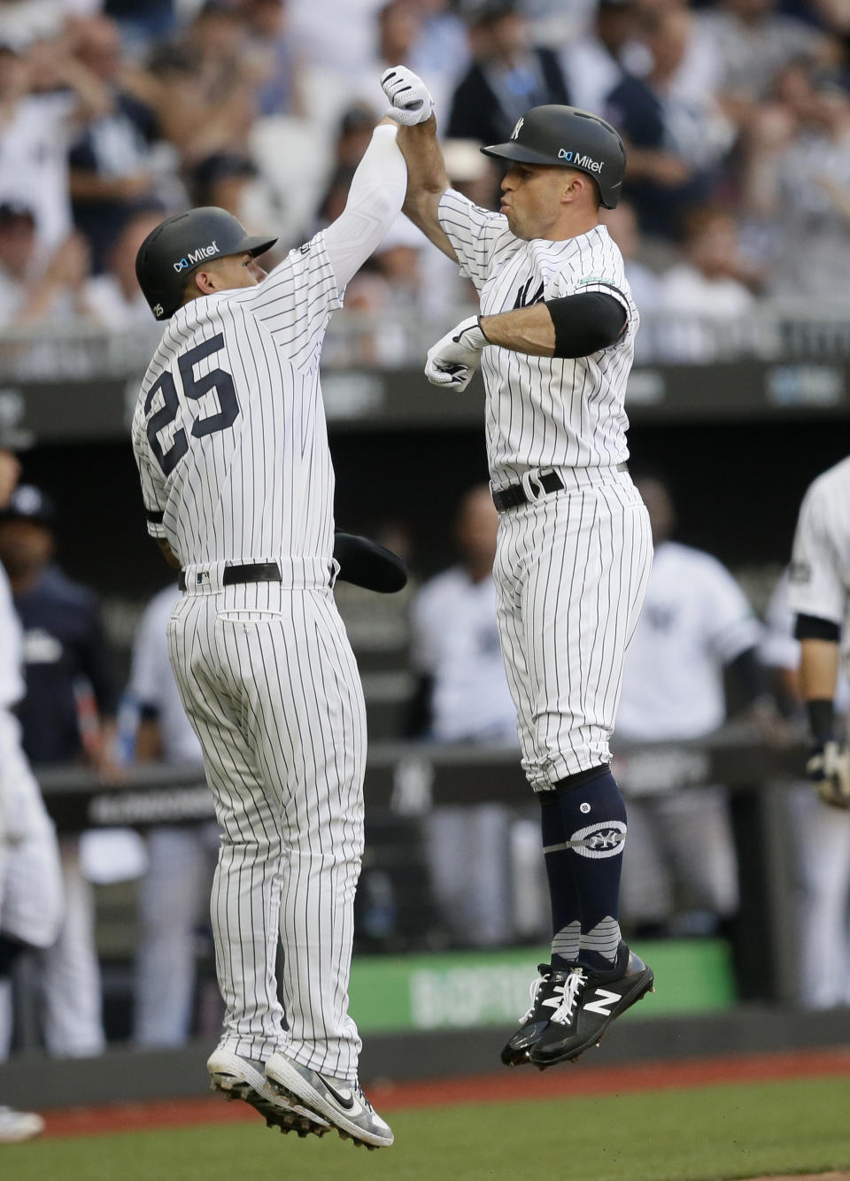 New York Yankees' Brett Gardner, right, celebrates after hitting a two-run home run with Gleyber Torres during the third inning of a baseball game against the Boston Red Sox, Saturday, June 29, 2019, in London. Major League Baseball made its European debut game today at London Stadium. (AP Photo/Tim Ireland)