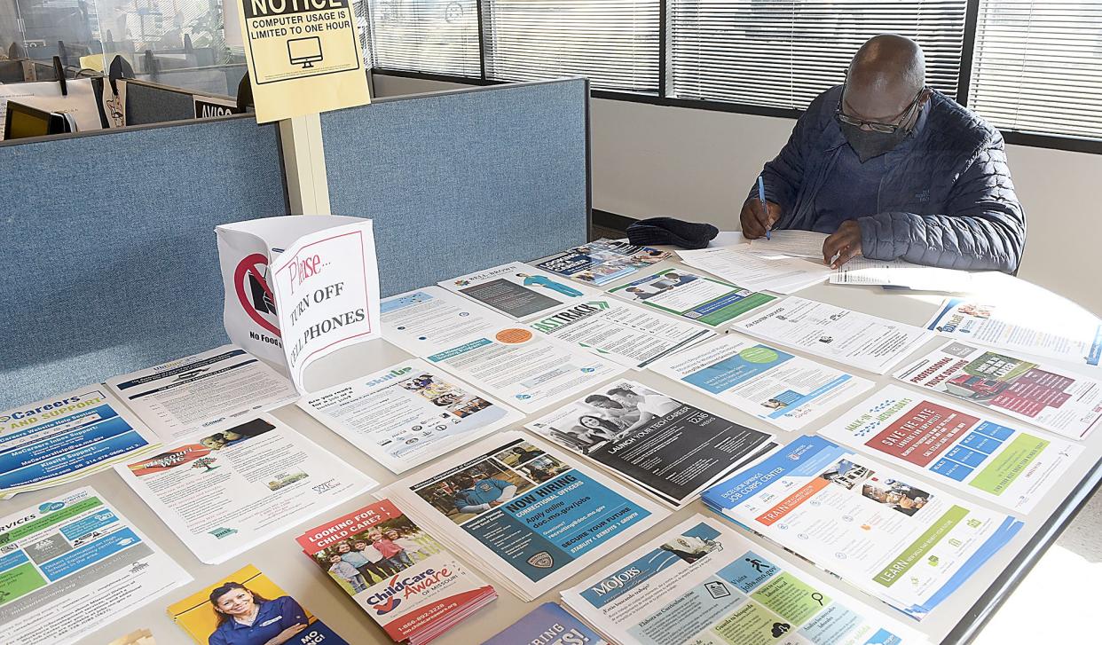 Ken Jordan of Columbia fills out a job application for a position with the Transportation Security Administration in January during a job fair at the Columbia Job Center.