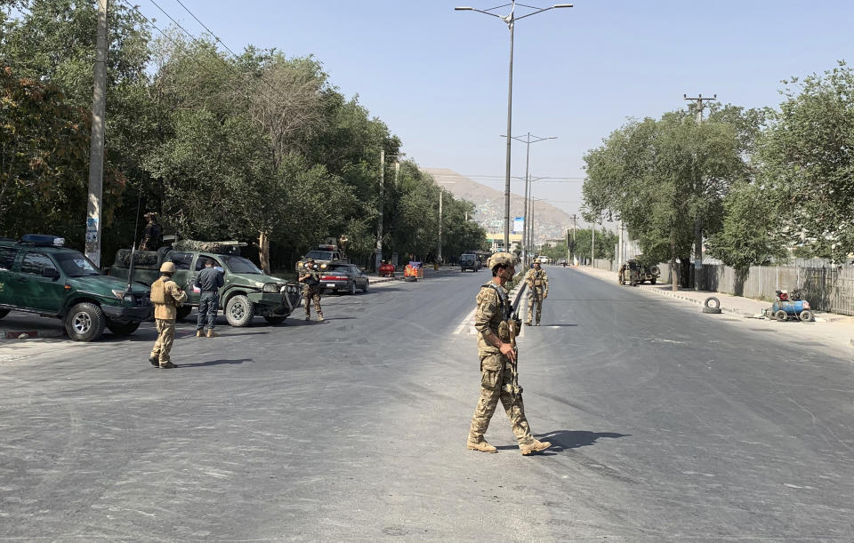 Afghan police arrive at the site of an explosion in Kabul, Afghanistan Thursday, July 25, 2019. Police say the target of the attack Thursday morning was a passenger bus belonging to the Ministry of Mines. (AP Photo/Rahmat Gul)