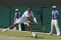 Nick Kyrgios of Australia hits a shot during his match against Milos Raonic of Canada at the Wimbledon Tennis Championships in London, July 3, 2015. REUTERS/Stefan Wermuth