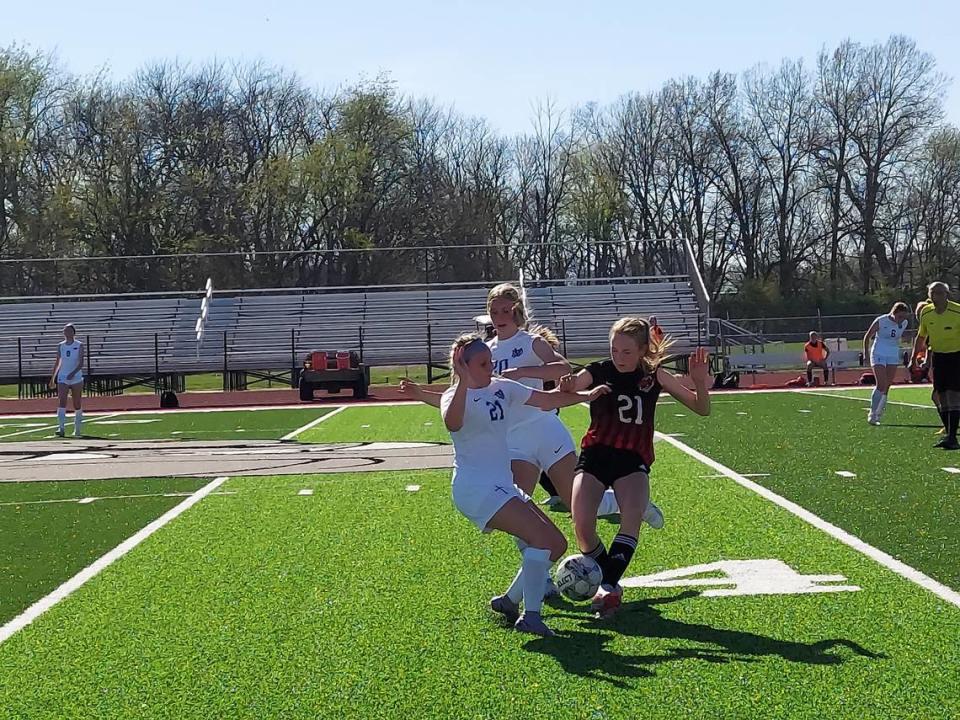 Mater Dei’s Brianna Noud and Amelia Beer battle Highland’s Alyson Pace for a loose ball just past midfield during a nonconference game Wednesday, April 12, at Highland High School. The Knights ultimately posted a 2-0 victory. Jonathan Duncan/For The News Leader