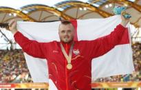 Athletics - Gold Coast 2018 Commonwealth Games - Men's Hammer Throw Final - Carrara Stadium - Gold Coast, Australia - April 8, 2018. Gold medalist Nick Miller of England poses. REUTERS/Paul Childs