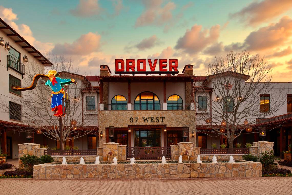 The 97 West entrance has a neon cowboy under the old-time “Drover” sign.