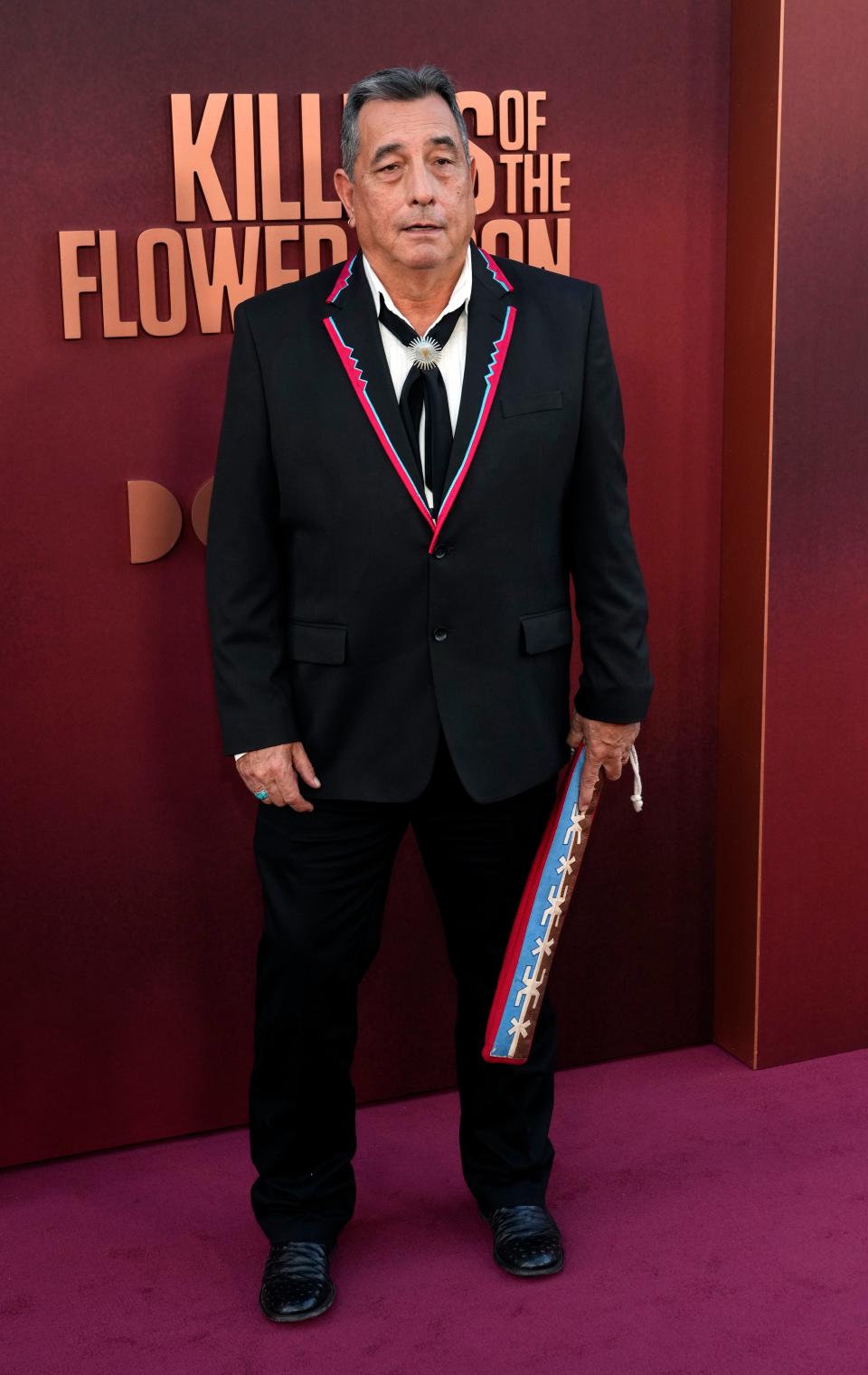 Osage Nation music consultant and composer Scott George poses at the Los Angeles premiere of the film "Killers of the Flower Moon," Monday, Oct. 16, 2023, at the Dolby Theater. (AP Photo/Chris Pizzello)