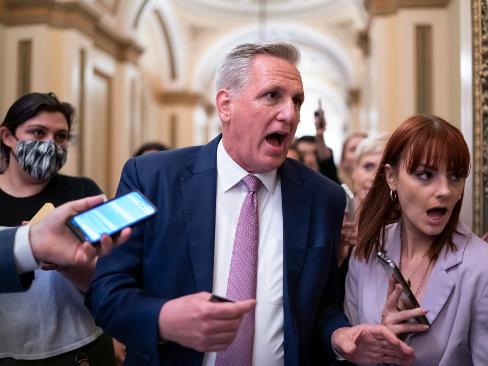 FILE - House Minority Leader Kevin McCarthy, R-Calif., heads to his office surrounded by reporters after House investigators issued a subpoena to McCarthy and four other Republican lawmakers as part of their probe into the violent Jan. 6 insurrection, at the Capitol in Washington, May 12, 2022. With the promise of a red wave receding, Republicans are facing the stark reality that any return to power would mean presiding over a narrowly split Congress. Meanwhile, McCarthy was weakened by the party's dismal performance as he reaches for the speaker's gavel (AP Photo/J. Scott Applewhite, File)