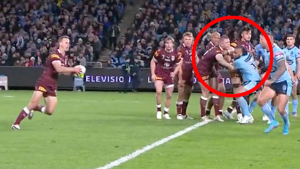 NSW prop Junior Paulo appeared to be held back in the scrum moments before Daly Cherry-Evans crossed for a QLD try. Pic: Ch9