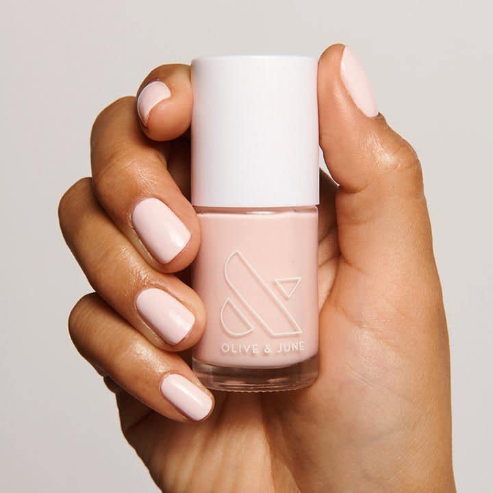 <p>Because you’ll need a trusty color that will work for all of those June weddings... </p> <p>We love this baby pink because it goes on perfectly opaque and creamy—no streaks or see-through spots allowed! Plus, it’ll bring out your early summer tan. </p> <p><strong>BUY IT: </strong>$8; <a href="https://oliveandjune.com/products/gh" rel="nofollow noopener" target="_blank" data-ylk="slk:oliveandjune.com;elm:context_link;itc:0;sec:content-canvas" class="link ">oliveandjune.com</a></p>