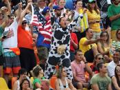 <p>A fan dressed as a cow cheers on from the stands. REUTERS/Alessandro Bianchi </p>