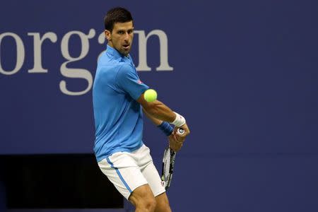 Sep 4, 2016; New York, NY, USA; Novak Djokovic of Serbia hits a backhand against Kyle Edmund of Great Britain (not pictured) on day seven of the 2016 U.S. Open tennis tournament at USTA Billie Jean King National Tennis Center. Mandatory Credit: Geoff Burke-USA TODAY Sports