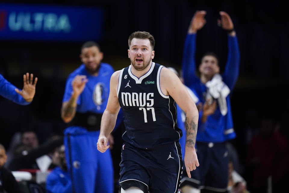 Dallas Mavericks' Luka Doncic (77) runs up the court after making a basket against the Los Angeles Lakers during the first half of an NBA basketball game Thursday, Jan. 12, 2023, in Los Angeles. (AP Photo/Jae C. Hong)