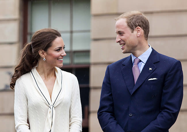 Prince William and Kate Middleton at each other