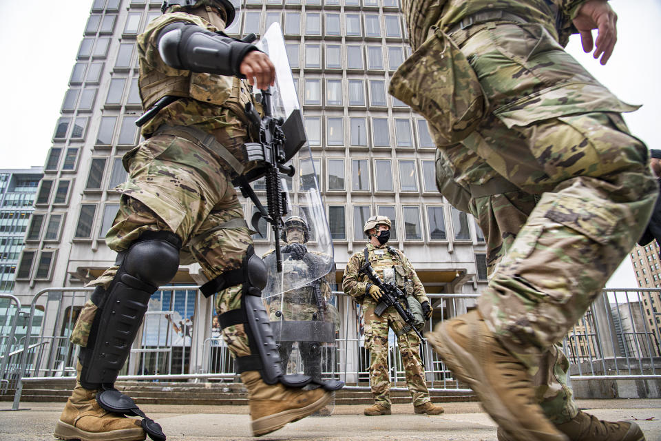 Members of the National Guard stand in guard in front of the Philadelphia Municipal Services Building in Philadelphia, Pa., Friday, Oct. 30, 2020. (Jose F. Moreno/The Philadelphia Inquirer via AP)