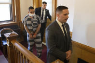 Hadi Matar, 24, left, arrives for an arraignment in the Chautauqua County Courthouse in Mayville, NY., Thursday, Aug. 18, 2022. Matar was arrested Aug. 12 after he rushed the stage at the Chautauqua Institution and stabbed Salman Rushdie in front of a horrified crowd. (AP Photo/Joshua Bessex)