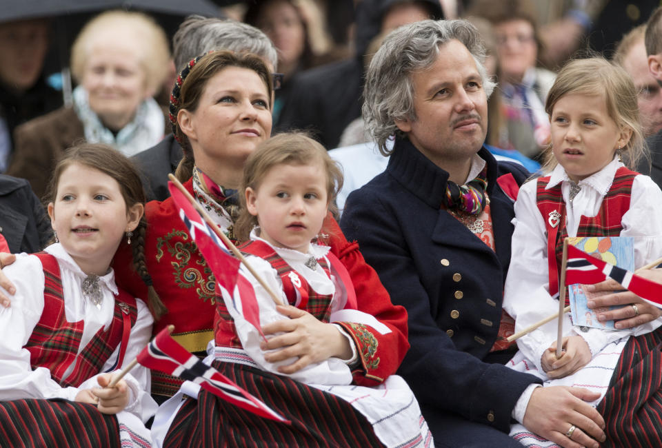 A photo of Princess Martha Louise, Ari Behn, Maud Angelica, Leah Isadora and Emma Tallulah wearing national dress in Southwark Park as they celebrate Norway National Day on May 17, 2013 in London, England.