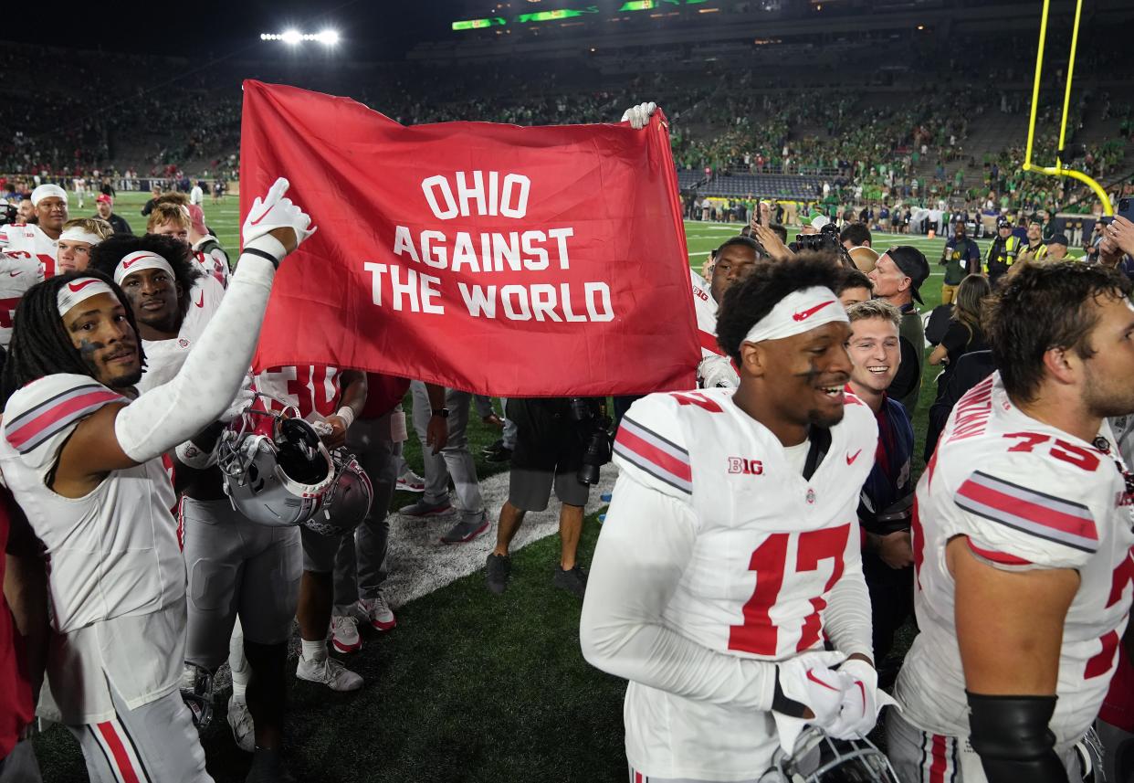 Sep 23, 2023; South Bend, Indiana, USA; Ohio State Buckeyes players celebrate as they leave the field after beating Notre Dame Fighting Irish 17-14 at Notre Dame Stadium.