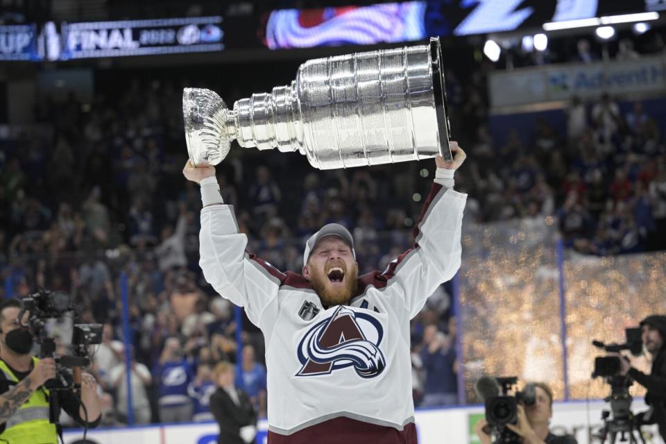 Colorado Avalanche left wing Gabriel Landeskog lifts the Stanley Cup after the team.