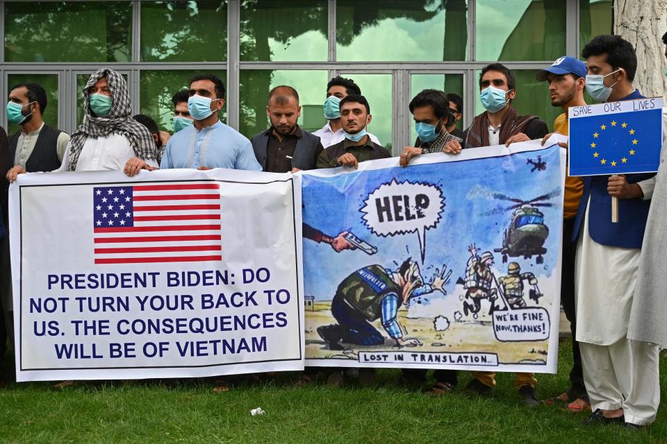 Afghans who worked as interpreters for U.S. and NATO forces gather during a demonstration April 30 in downtown Kabul to plead for help from the West as Washington pulls troops from the country. The Afghans fear retaliation against them and their families.