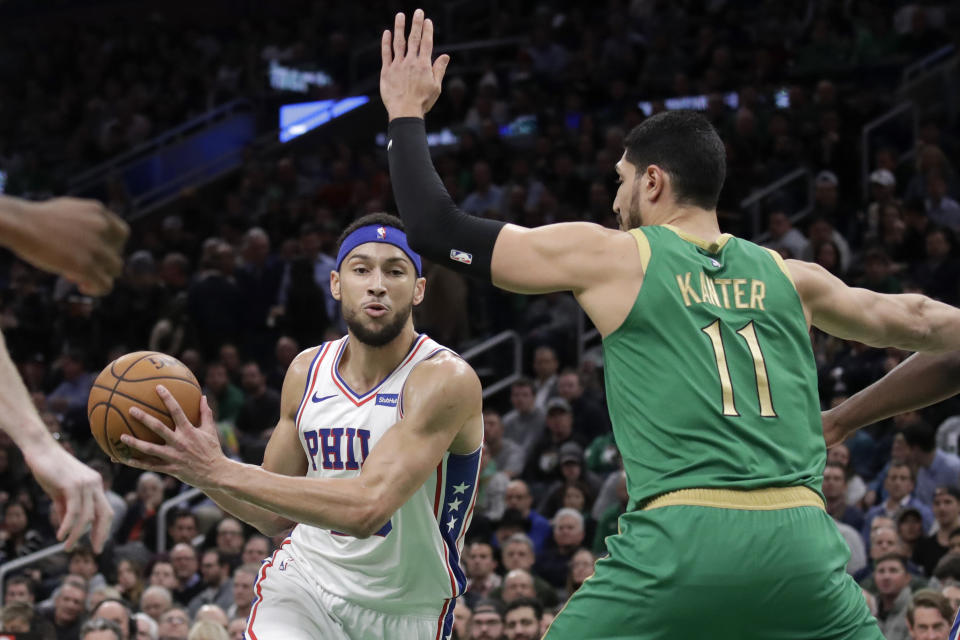 Philadelphia 76ers guard Ben Simmons (25) drives against Boston Celtics center Enes Kanter (11) in the first quarter of an NBA basketball game, Thursday, Dec. 12, 2019, in Boston. (AP Photo/Elise Amendola)