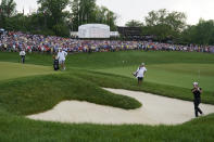 Patrick Cantlay hits out of a bunker during the first playoff hole during the final round of the Memorial golf tournament, Sunday, June 6, 2021, in Dublin, Ohio. (AP Photo/Darron Cummings)