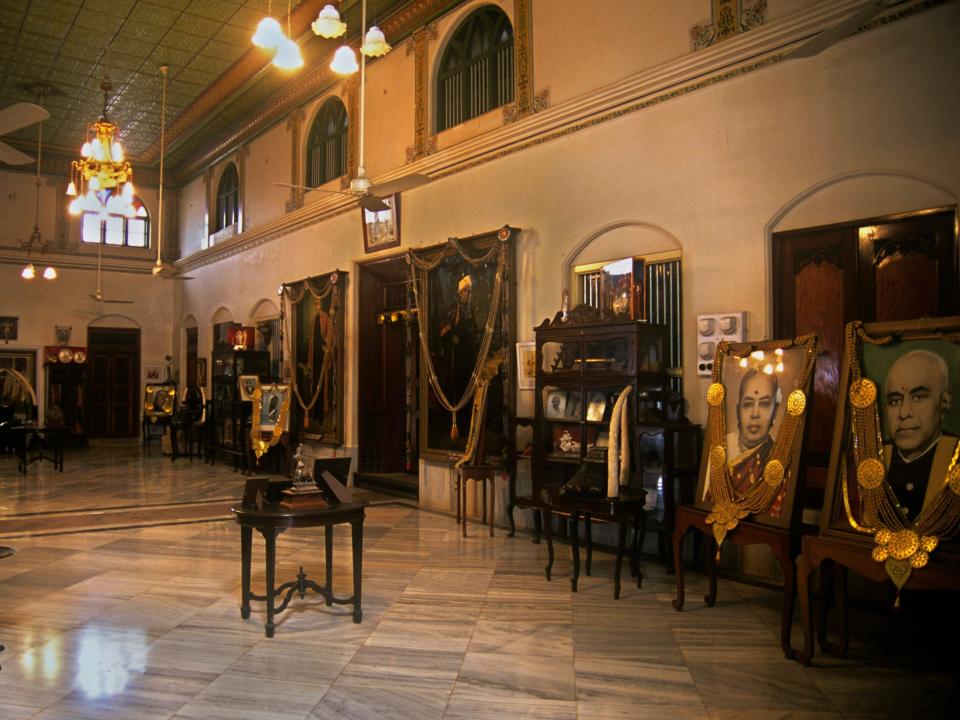 Ornate portraits and furniture are seen inside a Chettinad mansion in 2000.