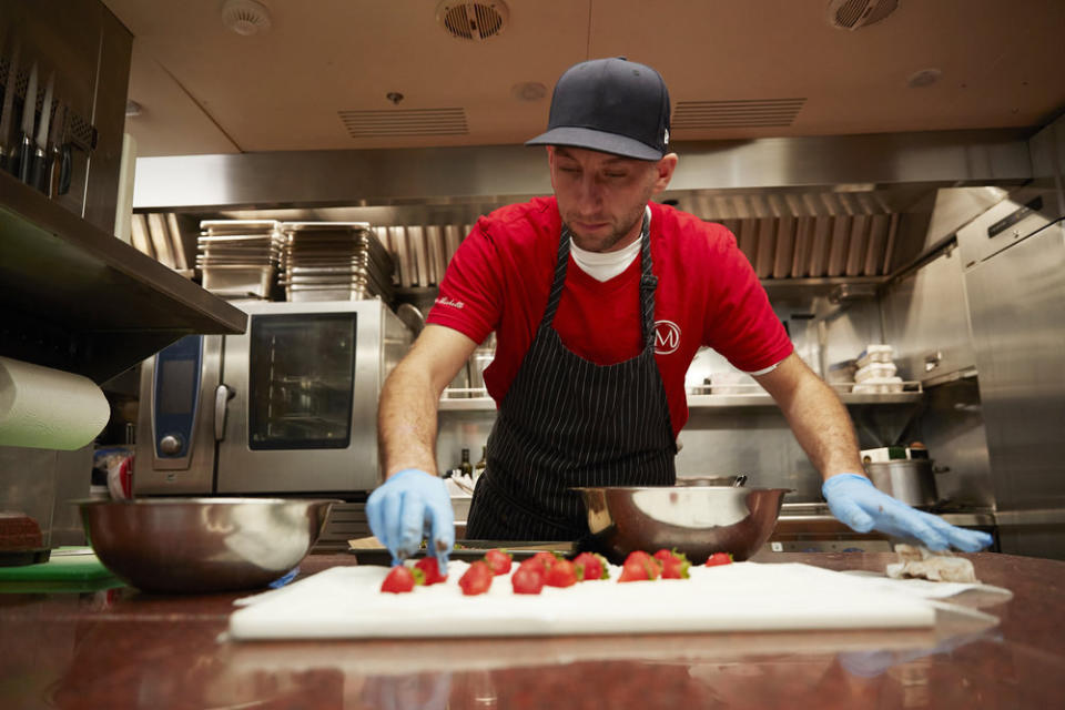 Matthew Shea prepares food