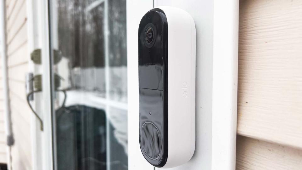 Arlo Video Doorbell 2K attached to house