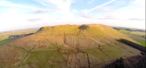 Burnswark Hill from the north, with one of the Roman camps visible on the slopes.