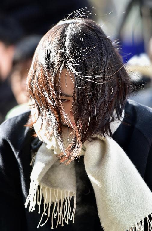 Cho Hyun-Ah, the daughter of Korean Air's chief executive, arrives for questioning at the prosecutors' office in Seoul on December 17, 2014