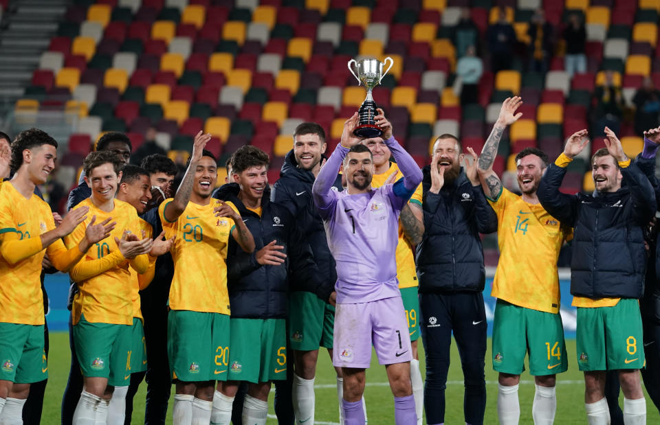 The Socceroos lift a standard trophy instead of the Soccer Ashes, which remained back in Australia due to its fragile nature. (Stephanie Meek/CameraSport via Getty Images)