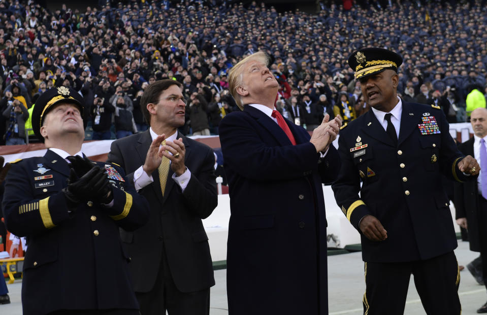 President Donald Trump, second from right, watches a flyover before the start of the Army-Navy football game in Philadelphia, Saturday, Dec. 8, 2018. Army Chief of Staff Gen. Mark Milley is at left,. and West Point Superintendent Lt. Gen. Darryl A. Williams, right. (AP Photo/Susan Walsh)