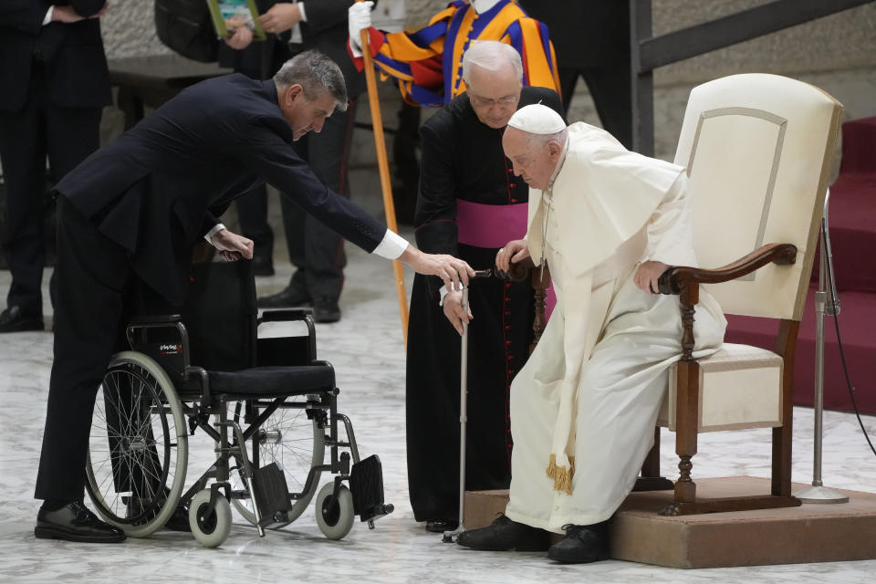 Pope Francis stands up during the weekly general audience at the Vatican, Wednesday, Dec. 13, 2023. (AP Photo/Gregorio Borgia)