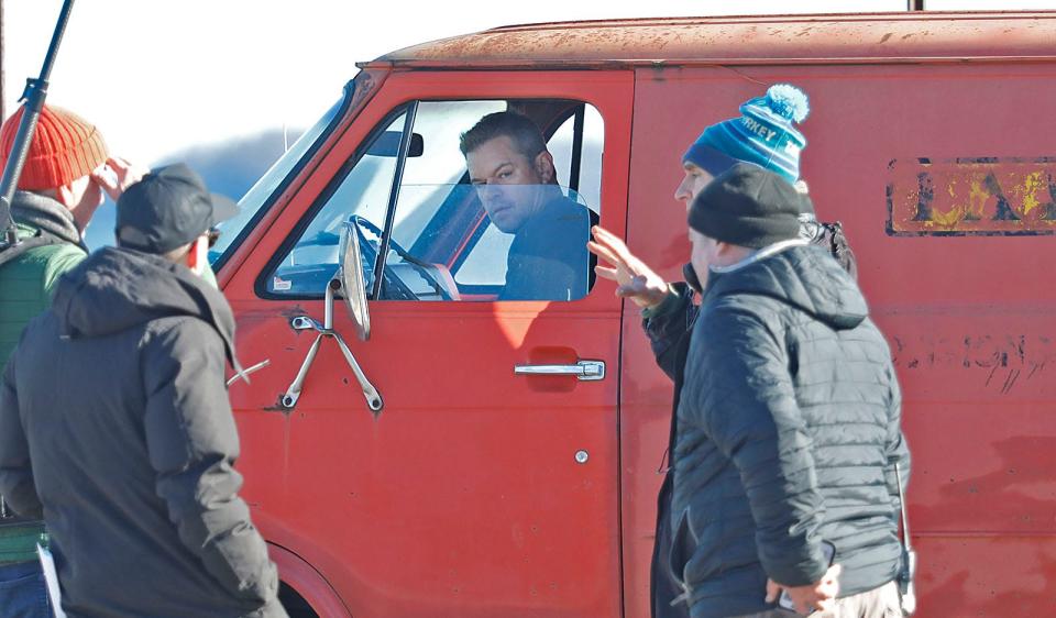 Matt Damon is behind the wheel of an old Chevy van during Tuesday's shoot.