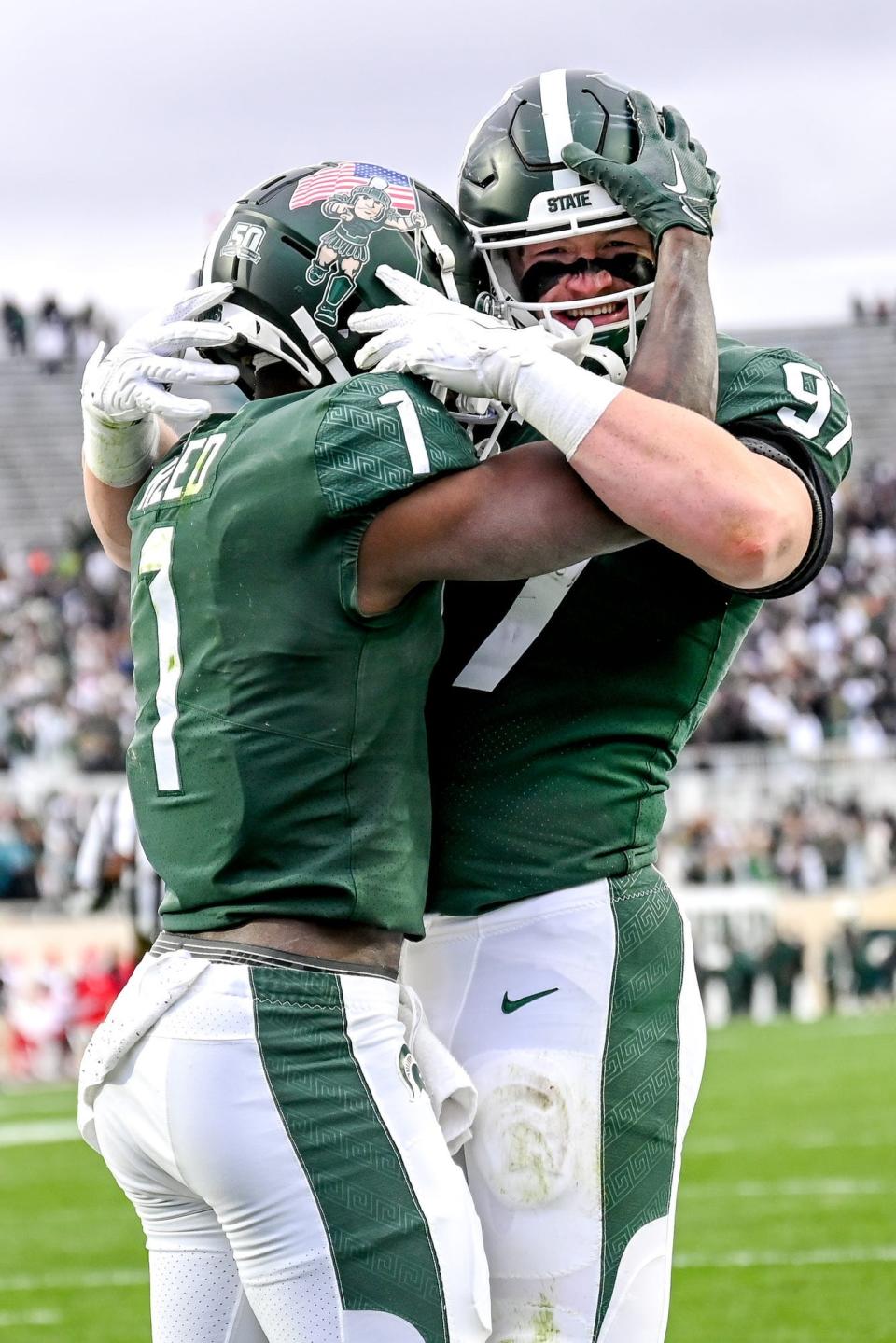 Michigan State's Jayden Reed, left, celebrates his touchdown with Tyler Hunt during the third quarter against Rutgers on Saturday, Nov. 12, 2022, in East Lansing.