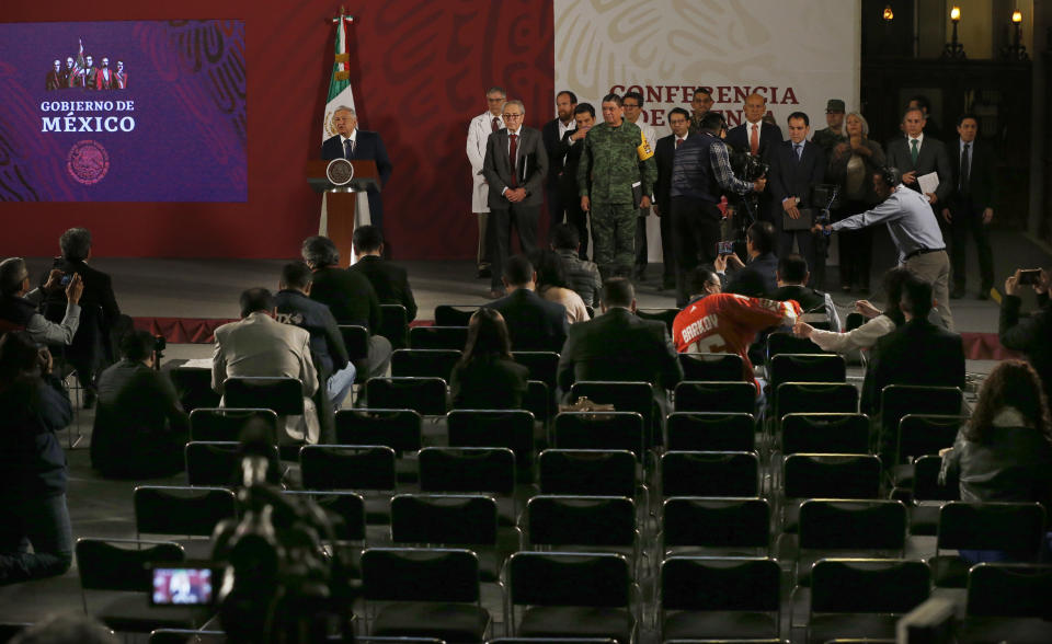 Few journalists attend the daily, morning news conference by Mexico's President Andres Manuel Lopez Obrador, due to the worldwide spread of the new coronavirus, at the presidential palace in Mexico City, Tuesday, March 24, 2020. (AP Photo/Marco Ugarte)