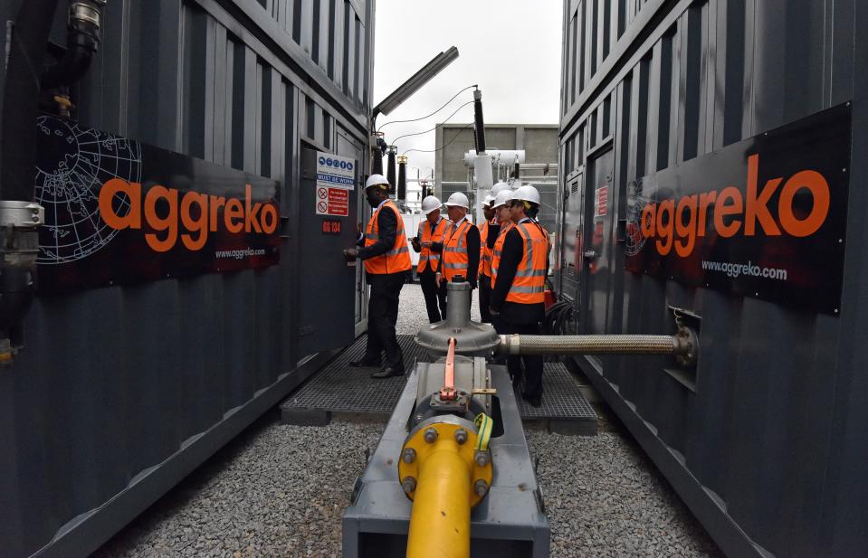 TO GO WITH AFP STORY BY CHRISTOPHE KOFFI
Experts of the Organisation for Economic Co-operation and Development (OECD) inspect equipment supplied by Aggreko at an electricity plant on the outskirts of the Ivorian capital Abidjan, on September 5, 2014. Aggreko is a leading rental company, supplying equipment for power and temperature control for temporary electrical energy. AFP PHOTO / SIA KAMBOU        (Photo credit should read SIA KAMBOU/AFP via Getty Images)