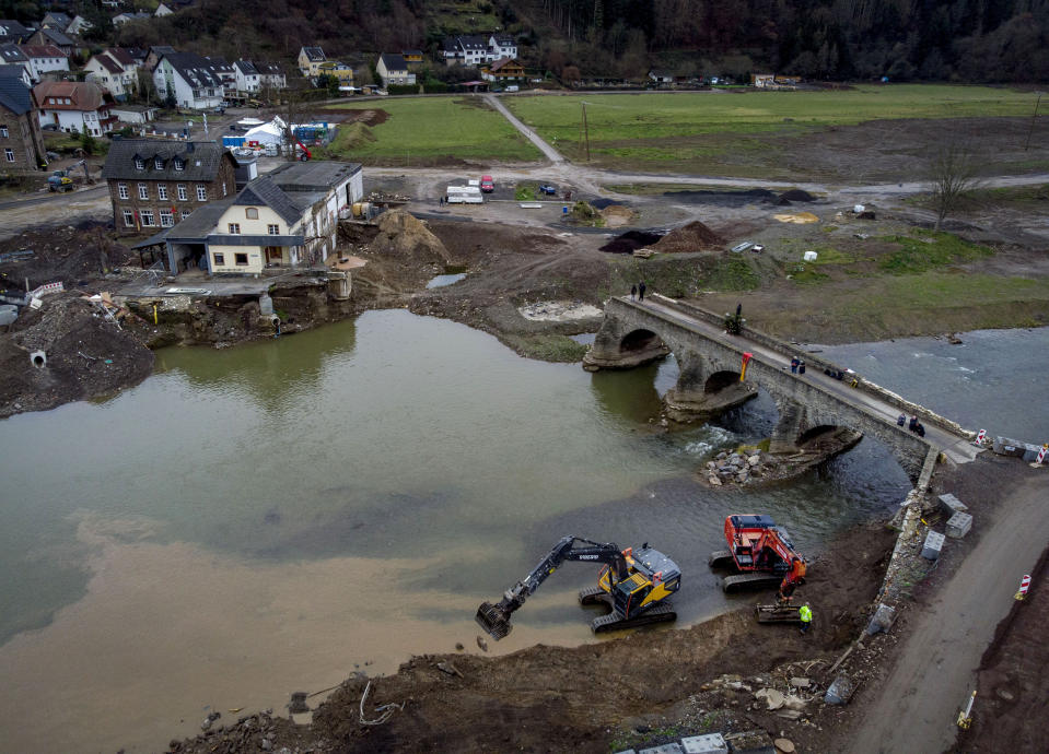 The remains of a bridge lead over the Ahr river in Resch in the Ahrtal valley, southern Germany, Tuesday, Dec.14, 2021. The floods in July claimed almost 200 lives, many of them in the narrow Ahr Valley that's best known for its vineyards and as a picturesque hiking destination.(Photo/Michael Probst)