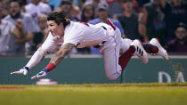 Boston Red Sox's Jarren Duran dives home to score, while advancing on an error after hitting an RBI triple, against the Toronto Blue Jays during the fourth inning of the second baseball game of a doubleheader at Fenway Park, Wednesday, July 28, 2021, in Boston. (AP Photo/Charles Krupa)