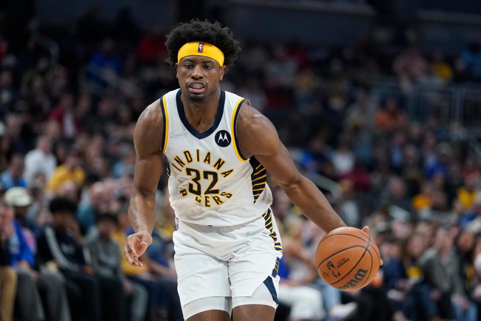 Indiana Pacers' Terry Taylor dribbles during the second half of an NBA basketball game against the Atlanta Hawks, Monday, March 28, 2022, in Indianapolis. (AP Photo/Darron Cummings)
