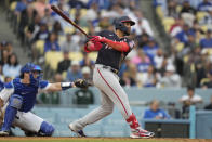 Washington Nationals' Luis Garcia (2) hits a home run during the eighth inning of a baseball game against the Los Angeles Dodgers in Los Angeles, Wednesday, May 31, 2023. Keibert Ruiz and Ildemaro Vargas also scored. (AP Photo/Ashley Landis)