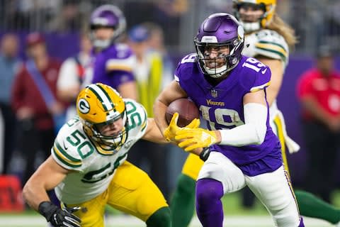 Minnesota Vikings wide receiver Adam Thielen (19) runs the ball in for a touchdown past Green Bay Packers linebacker Blake Martinez (50) during the third quarter at U.S. Bank Stadium - Credit: Harrison Barden/USA TODAY