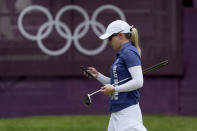 Jodi Ewart Shadoff, of Britian, checks her phone on the 10th green during a practice round prior to the women's golf event at the 2020 Summer Olympics, Tuesday, Aug. 3, 2021, at the Kasumigaseki Country Club in Kawagoe, Japan. (AP Photo/Andy Wong)