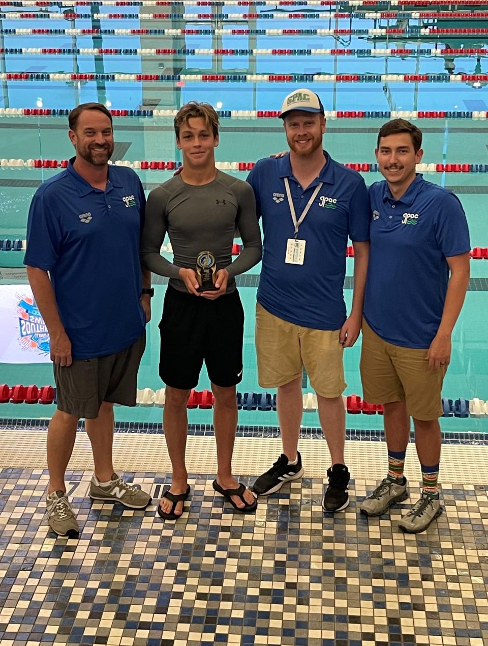 (From L to R) GPAC head coach Greg Johnson, 14-year old swimmer Ian Malone, head age group coach Nathan Smith and assistant coach Logan Cale pose for a photo at the end of the Southeastern Swimming Long Course Championships on July 17 at the Huntsville Aquatics Center from Huntsville, Ala..