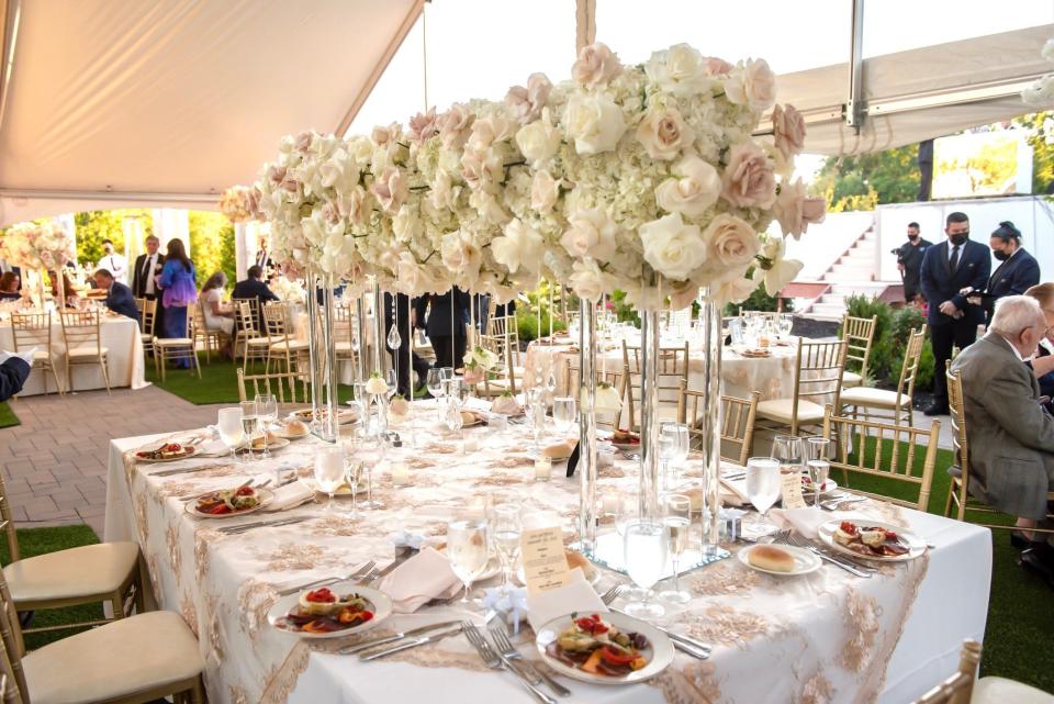 Centerpieces at John Tsiamtsiouris and Nicole Psomas Tsiamtsiouris's wedding at The Meadow Wood in Randolph, New Jersey. The florals were designed by Premier Events by Reema.