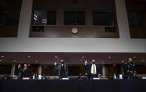 From left, Senior Department of Homeland Security official Office of Intelligence and Analysis Melissa Smislova, Assistant Director of FBI Counterterrorism Division Jill Sanborn, Senior Department of Defense Official for Homeland Defense and Global Security Robert G. Salesses and Commanding General District of Columbia National Guard Major General William J. Walker are sworn in before a Senate Committee on Homeland Security and Governmental Affairs and Senate Committee on Rules and Administration joint hearing Wednesday, March 3, 2021, examining the January 6, attack on the U.S. Capitol in Washington. (Shawn Thew/Pool via AP)