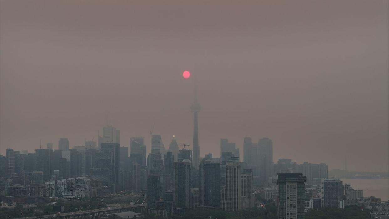 Last June, wildfire smoke lingered over Toronto for weeks, resulting in multiple air quality alerts. Wildfire conditions this summer could bring more of the same. (Patrick Morrell/CBC News - image credit)