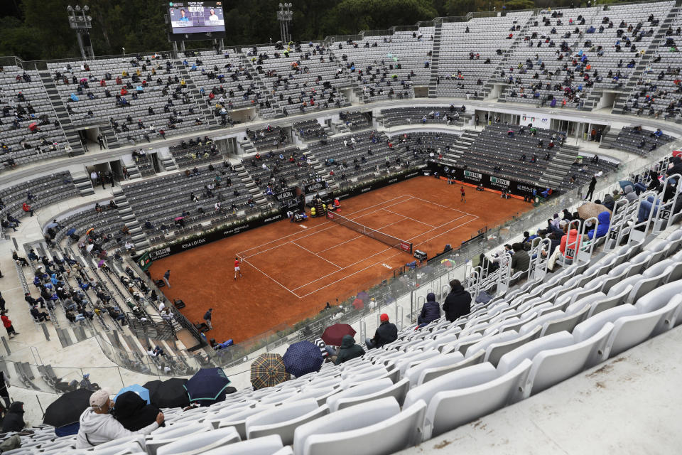 Spectators watch the quarter-final match between Serbia's Novak Djokovic and Greece's Stefanos Tsitsipas at the Italian Open tennis tournament, in Rome, Friday, May 14, 2021. (AP Photo/Gregorio Borgia)