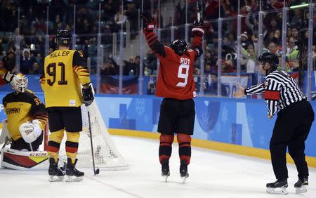 Ice Hockey - Pyeongchang 2018 Winter Olympics - Men Semifinal Match - Canada v Germany - Gangneung Hockey Centre, Gangneung, South Korea - February 23, 2018 - Derek Roy of Canada celebrates scoring his team's third goal as Moritz Muller and goalie Danny Aus Den Birken of Germany look on. REUTERS/David W Cerny