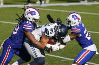 Buffalo Bills' Tremaine Edmunds (49) and Tre'Davious White (27) tackle Seattle Seahawks' Jacob Hollister (86) during the first half of an NFL football game Sunday, Nov. 8, 2020, in Orchard Park, N.Y. (AP Photo/Jeffrey T. Barnes)